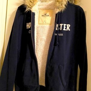 Hollister jacket with fur trim, navy and cream inside.